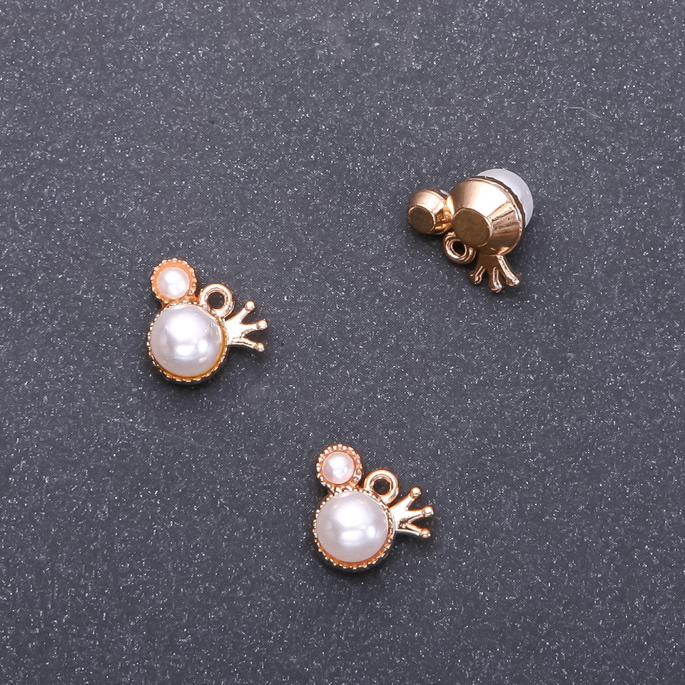 Zawieszka jubilerska Korona, średnica 11 mm, długość 13 mm, otwór o średnicy 1,5 mm, opakowanie 9 szt. (+ -)