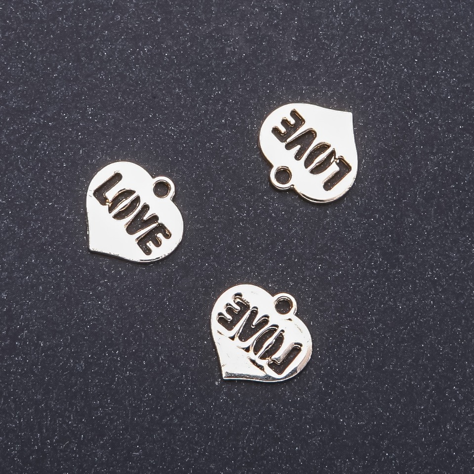 Zawieszka wisior Serce w kolorze jasnego złota, średnica 16 mm, długość 15 mm, opakowanie 12 szt. (+ -)