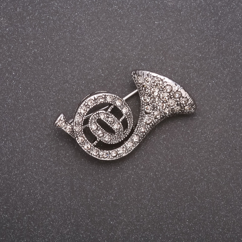 Broszka w kształcie tuby z kryształkami, metal szary, 30×20 mm