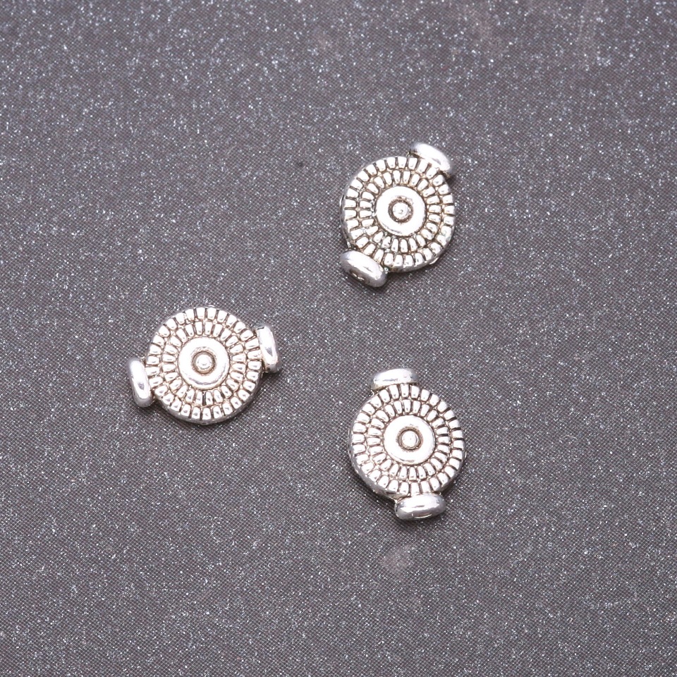 Furnitura – wstawka koralikowa, średnica 7x10 mm, średnica wewnętrzna 0,8 mm, fason 20 g +/- 37 szt.