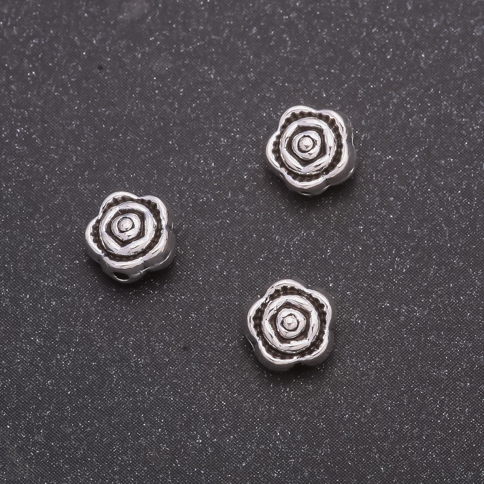 Wkładka koralikowa 7×4 mm, otwór 1 mm, opakowanie 20 g, około 38 szt.