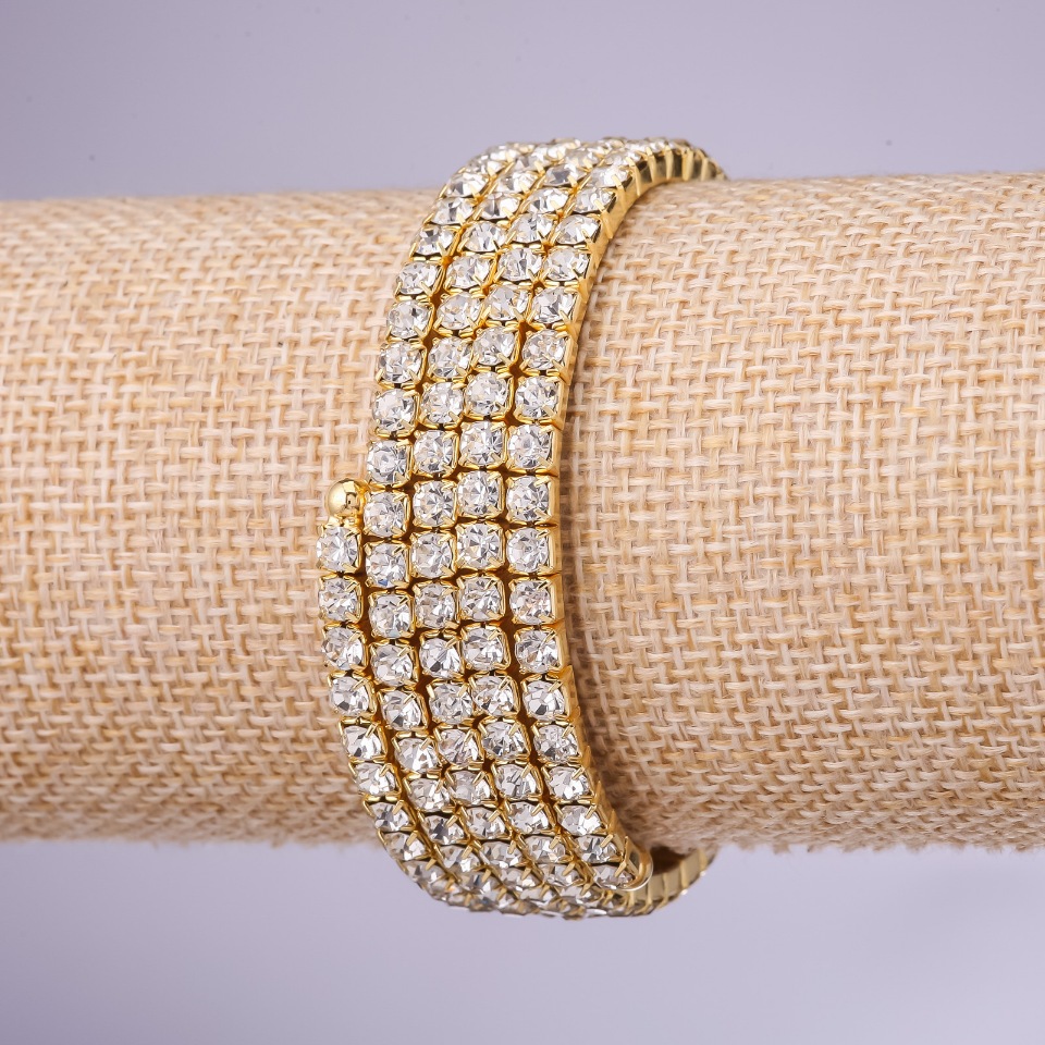 Bransoletka z cyrkoniami «Memori» — cztery owijki, białe cyrkonie, średnica 4 mm, żółty metal