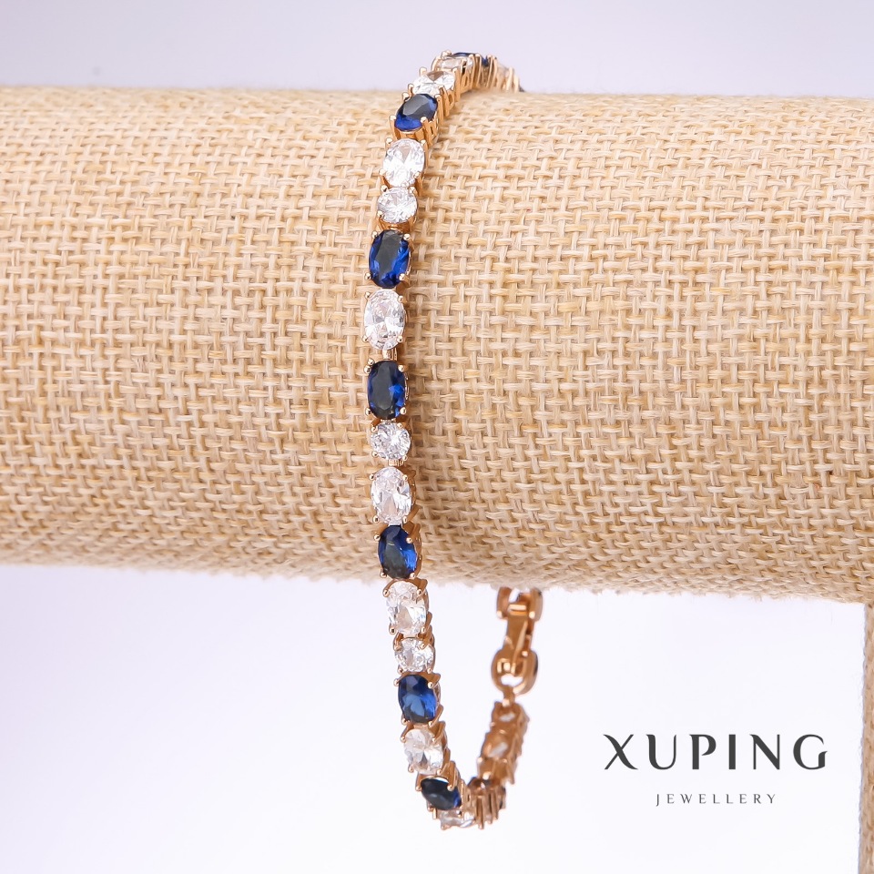 Bransoletka Xuping z białymi i niebieskimi kamieniami, grubość 4,5 mm, długość 18–21 cm, pozłacana 18k