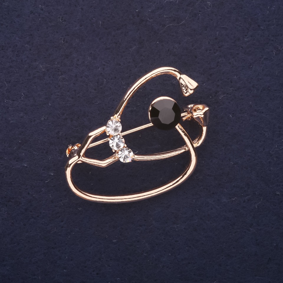 Broszka w kształcie stetoskopu z kryształami, kolor czarny i biały, 37×26 mm, metal złocisty