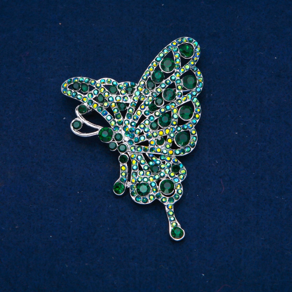 Broszka Motyl z zielonymi i benzynowymi cyrkoniami, metal złocisty 75×50 mm +