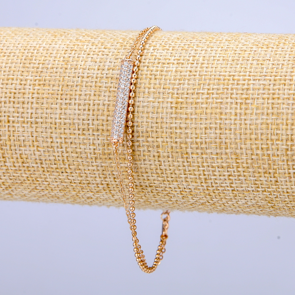 Bransoletka Xuping pozłacana 18K z białymi strassami, grubość 3 mm, długość 18–21 cm