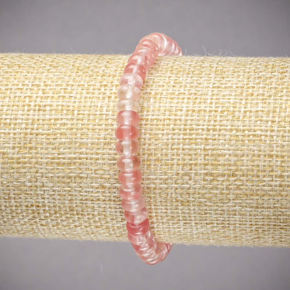 Bransoletka na gumce z naturalnego chalcedonu, gładkie rondelki, średnica około 6×4 mm, długość 18 cm