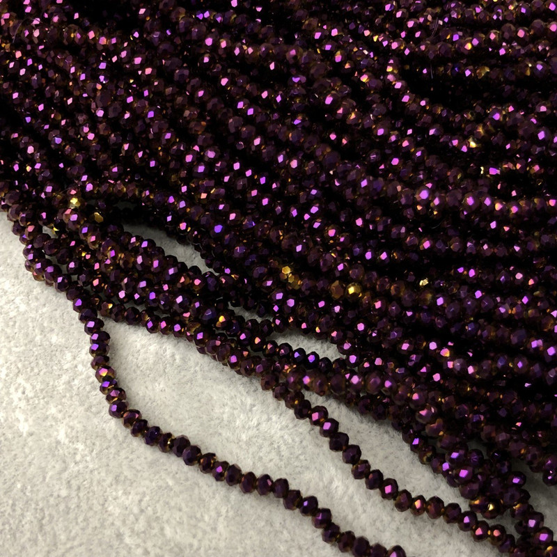 Koraliki czeskiego kryształu na żyłce w odcieniu śliwkowego napylania z delikatnym benzynowym połyskiem, fasetowane rondelki, średnica 3 x 2,5 mm, długość 36-38 cm + -