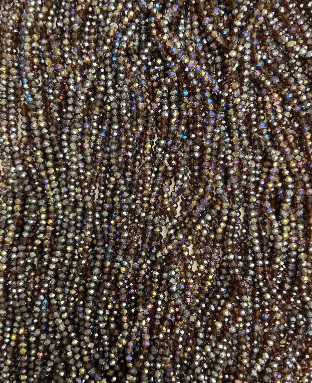 Koraliki czeskiego kryształu na żyłce brązowe z benzynowym połyskiem, fasetowane rondelki, średnica 3,5×3 mm, długość około 32 cm