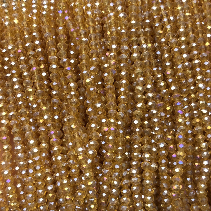 Koraliki z czeskiego kryształu na żyłce, pomarańczowo-brzoskwiniowe, przejrzyste z benzynowym połyskiem, fasetowane rondelki, średnica 3,5 × 3 mm ±, długość 36–38 cm