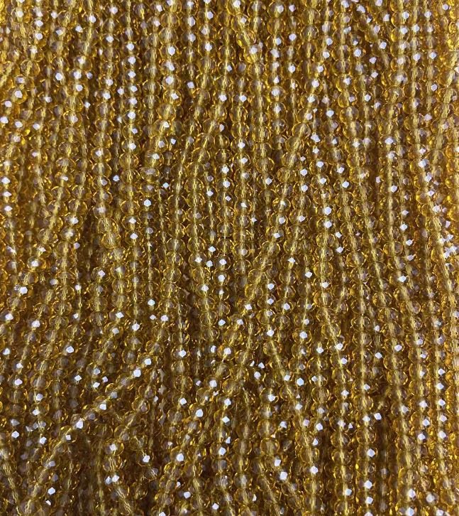 Koraliki czeskiego kryształu na żyłce, bursztynowo przezroczyste, fasetowane rondelki, średnica 3,5×3 mm, długość 33 cm +