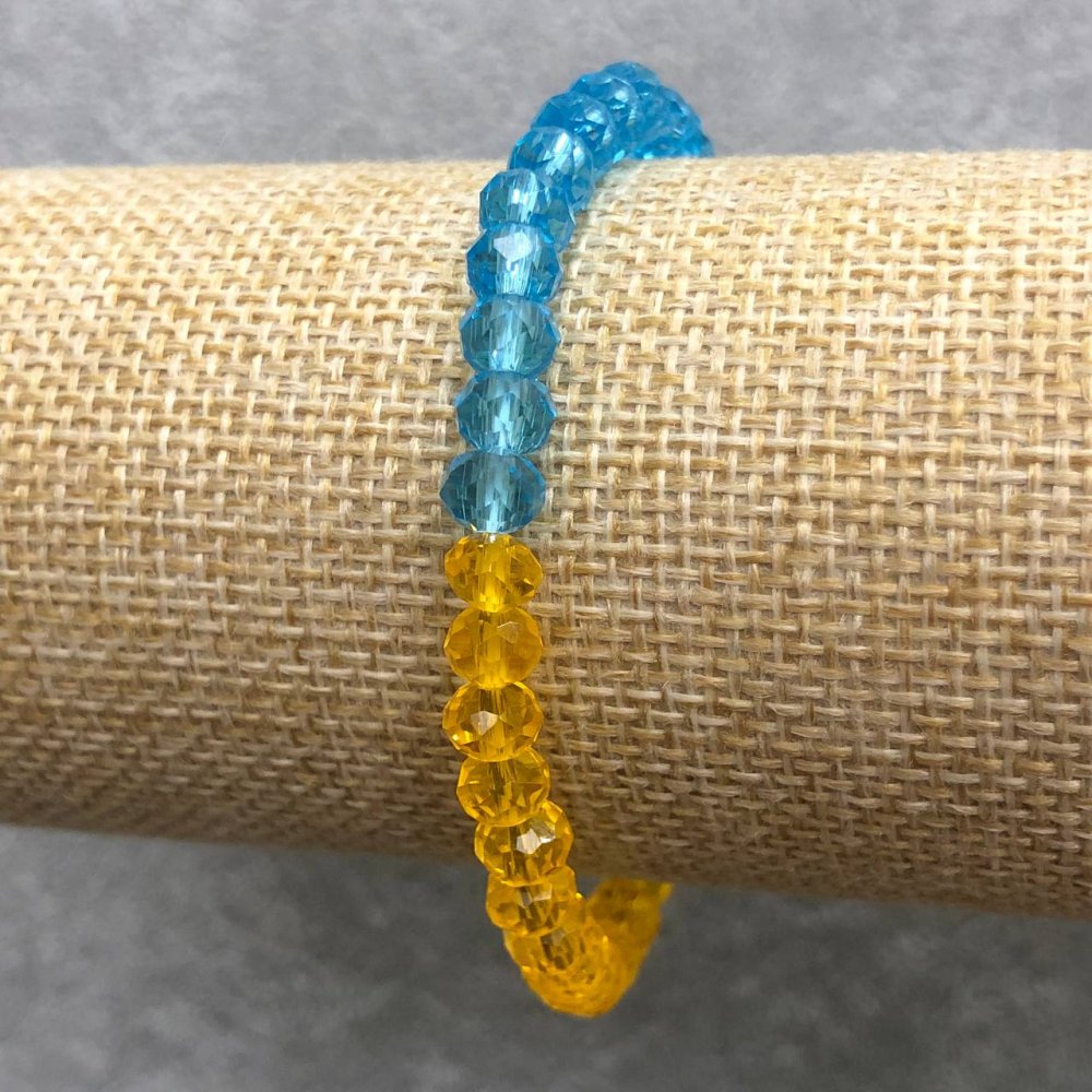 Bransoletka na gumce z czeskiego kryształu „Ukraina” fasetowane rondelki, średnica 6×4 mm, długość 18 cm