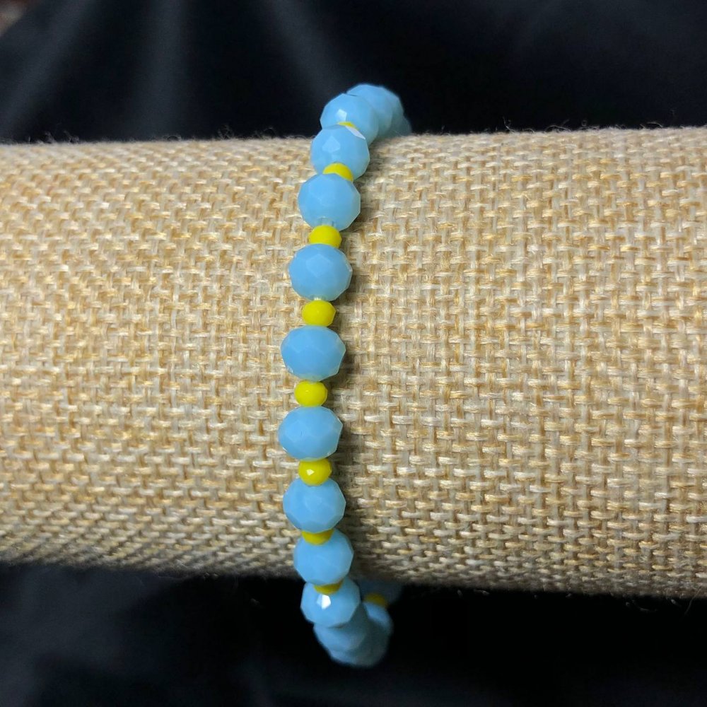 Bransoletka na gumce z czeskiego kryształu Ukraina, fasetowane rondelki, średnica 6×4 mm, długość 18 cm