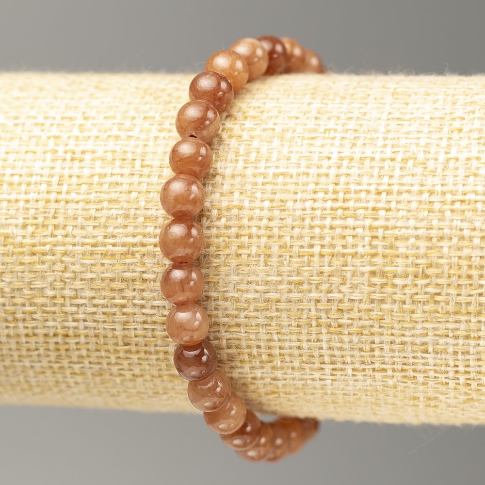 Bransoletka na gumce z selenitu (akryl sztuczny), gładka kulka, średnica 6,5 mm, długość 18 cm