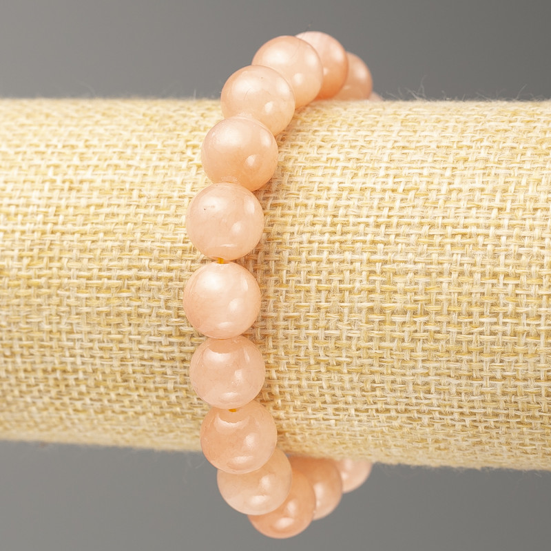 Bransoletka na gumce Selenit (sztuczny akryl) gładka kuleczka, średnica 10 mm, długość 18 cm