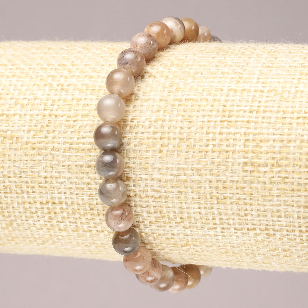 Bransoletka na gumce z naturalnego selenitu, gładka kulka, średnica 6 mm+