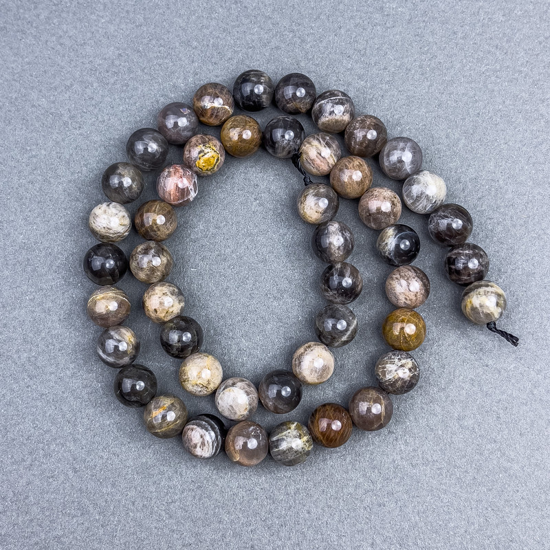 Koraliki z kamienia słonecznego, naturalne, gładkie kuleczki, średnica 8,5 mm, na nici, długość 39 cm