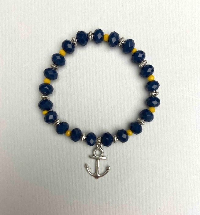 Bransoletka z czeskiego kryształu niebiesko-żółta fasetowanych rondeli, średnica 8×6 mm, 3,5×3 mm ±, długość 18 cm (rozciągana) z metalowymi wstawkami